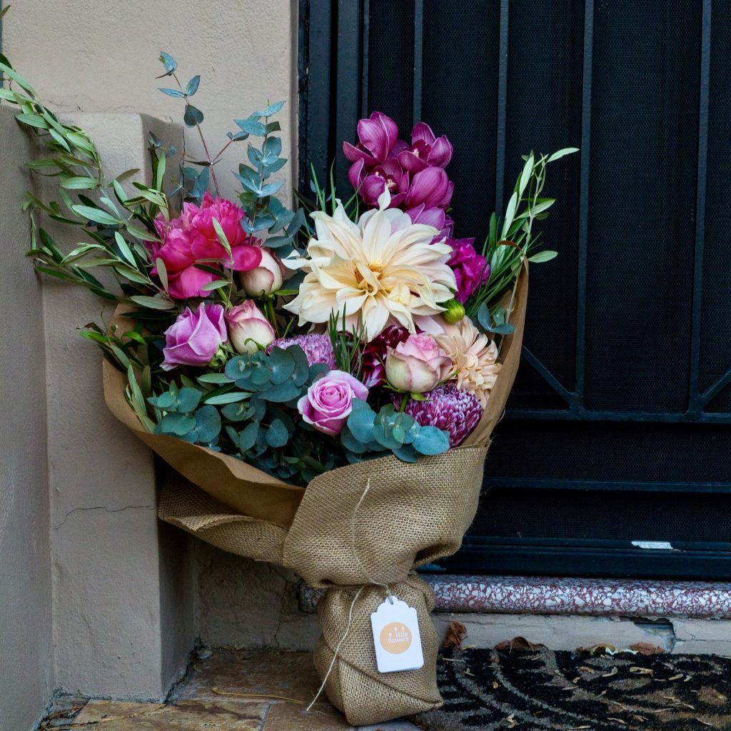 A fresh flower bunch left at a doorstep