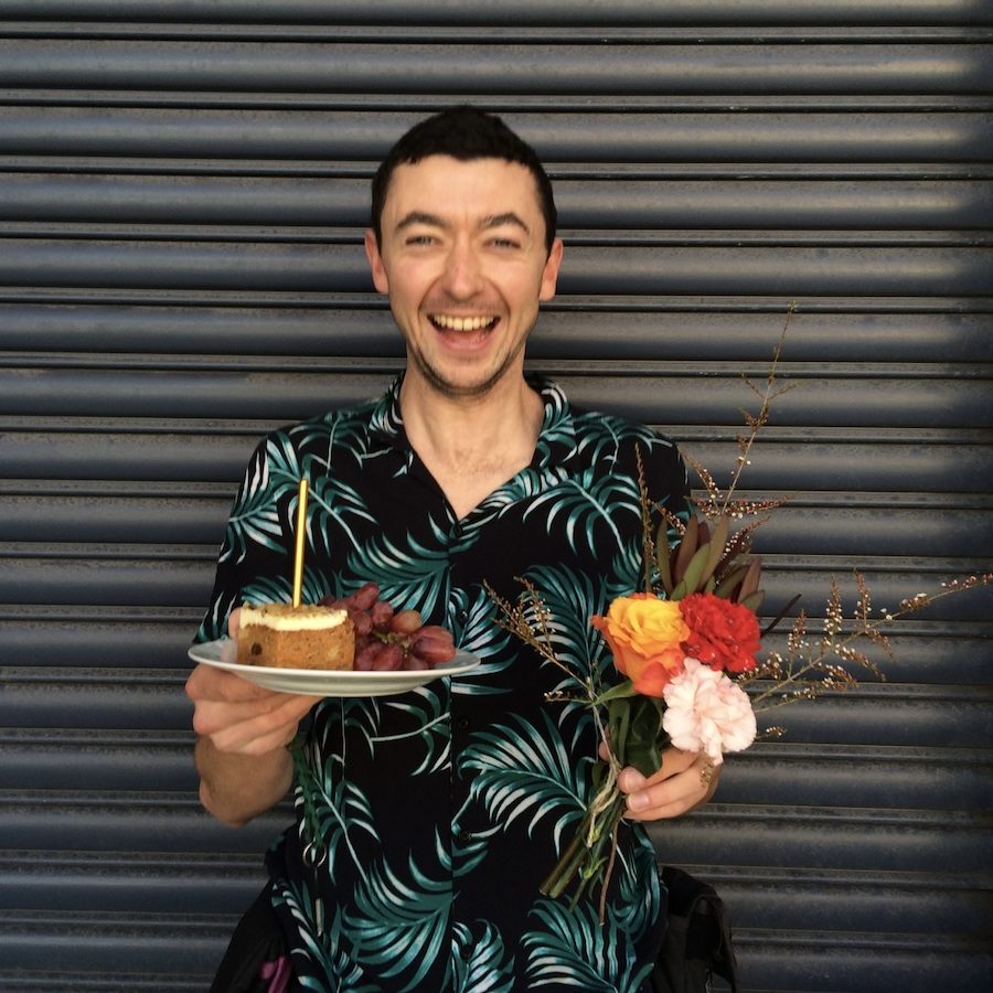 birthday cake and flowers gifted to man
