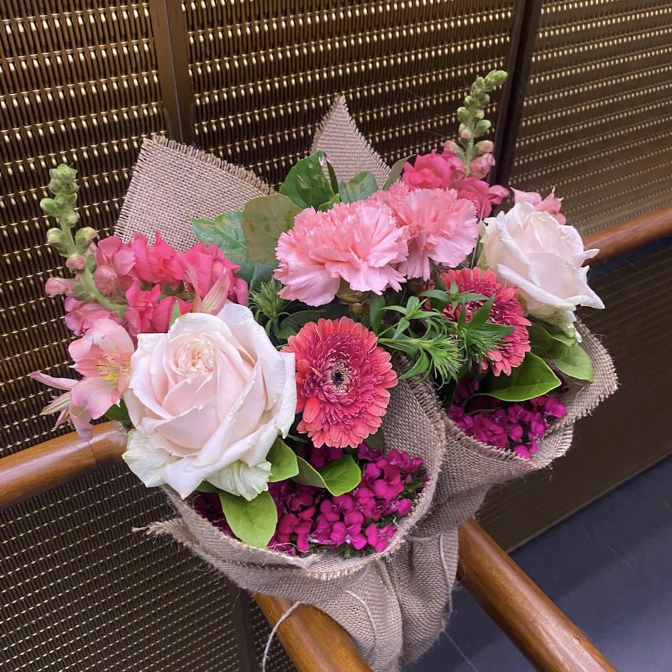 Close-up of two Daily Mixed Bouquets in office lift